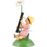 Blumenkind mit Anthurie und Fagott sitzend, farbig - 11 cm
