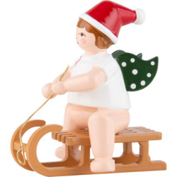 Weihnachtsengel mit Mütze auf Schlitten sitzend - 6,5 cm