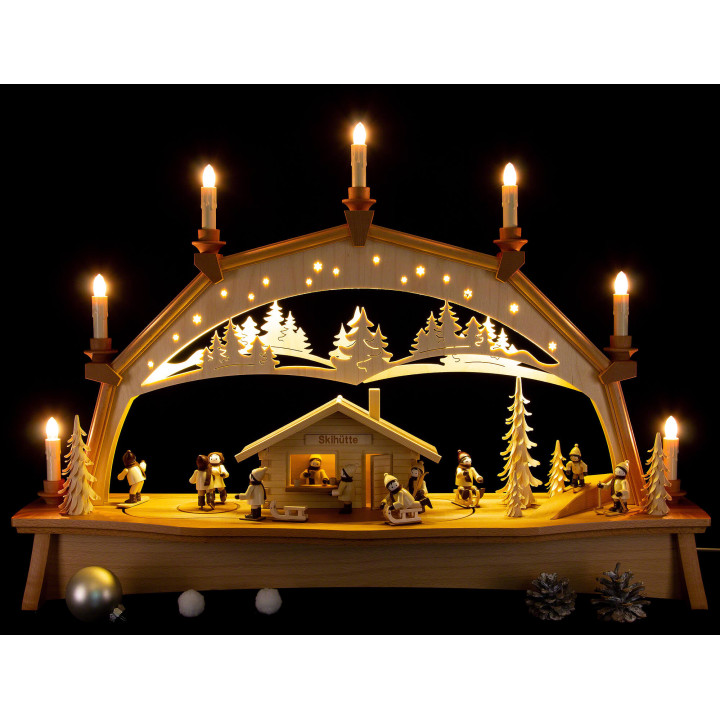 Schwibbogen Skihütte mit beweglichen Winterkindern - 76x52 cm